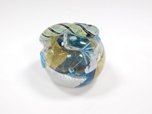 A Twists glass paperweight, designed by Mike Hunter, moulded over the body with a lizard, 10.5cm diameter. - 2