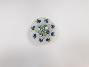 A Peter McDougall millefiori and scrambled latticino glass paperweight, with an outer band of violets, dated cane for 2010, bears paper label, 7cm diameter. - 2