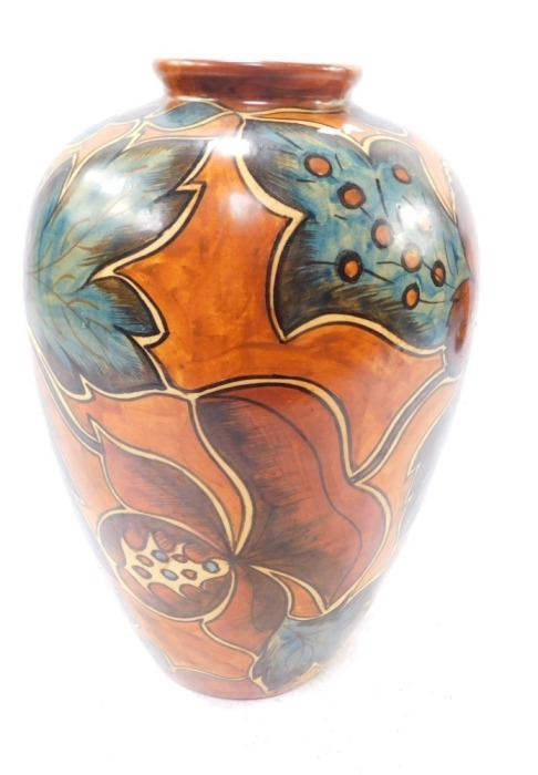 An early 20thC Clews Chameleon ware vase, decorated with stylised flowers against a light brown ground, No 234, impressed printed and painted marks, 25cm high.