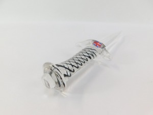A Langham Glass paperweight, of dagger form, the handle with white and black spiral twist decoration, bears paper labels, 30cm wide. - 2
