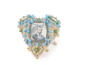 A George V Coronation sweetheart pin cushion, 20thC with a portrait of The King, and 'With Best Wishes' to the shoulders, otherwise decorated with wirework and beading, 16cm wide. - 2