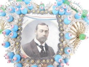A George V Coronation sweetheart pin cushion, 20thC with a portrait of The King, and 'With Best Wishes' to the shoulders, otherwise decorated with wirework and beading, 16cm wide. - 3