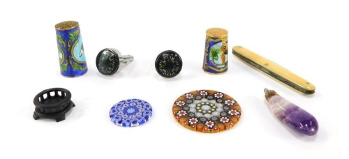 Two millefiori glass discs, Blue John pendant, pair of compass cuff links, two cloisonne enamel thimbles, small wooden stand and an ivory backed folding pen knife. Auctioneer Announce: The illustrated penknife is no longer in this lot.