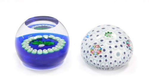 A John Deacons millefiori sea urchin type paperweight, bearing signed cane, dated 2009, and paper label, 6cm wide, together with a Caithness miniature thistle paperweight, 5.5cm wide. (2)