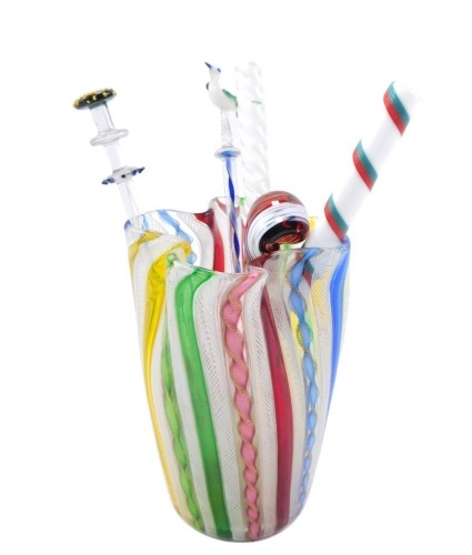 A Venetian Latticino and varied coloured spiral twist glass vase, of pinched cylindrical form, 12cm high, together with two glass stirrers, of cylindrical form, further stirrer with club handle, Venetian glass spoon and a glass swizzle stick with bird ter