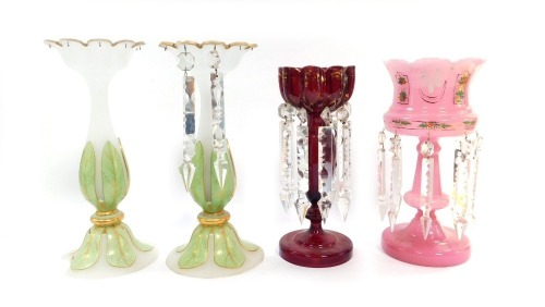 Four 19thC glass lustres, comprising a pair of opaline and green leaf moulded glass lustres, with gilt highlighting, 34cm high, a ruby glass lustre with prismatic drops, 29cm high, and a pink glass lustre with painted floral decoration and prismatic drops