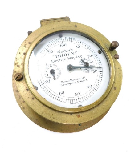 An early 20thC Walker's "Trident" electric ship's log, brass cased, circular white dial bearing nautical miles and two subsidiary dials, serial no. X6078, 19cm wide.