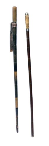 A horn walking stick, early 20thC, with leather strop, 81cm wide, together with a bamboo walking stick, with horn handle, 89cm wide. (2)