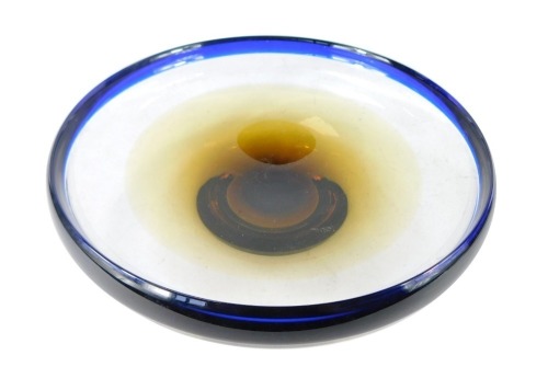 A heavy blue amber and clear studio glass bowl, of high sided and footed form, bears indistinct etched mark to base, 27cm wide.