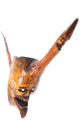 A late 19thC Continental carved wooden pipe of novelty figural form, 61cm wide.