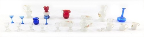 A group of late 19thC and later miniature glass ware, to include a part milk glass set, painted with flowers, clear glass goblets, decanter stopper and three wine glasses, and ruby glass jug. (a quantity)