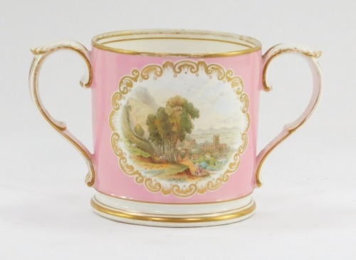 A late 19thC Graingers Worcester porcelain loving cup, with a gilt rim and scroll handles, decorated with views of Worcester against a pink ground, printed mark, 12cm high.