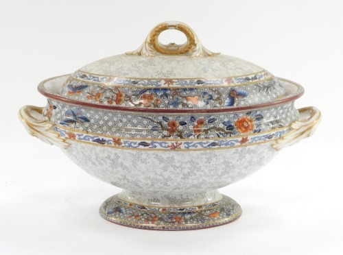 A Royal Worcester late 19thC pottery soup tureen and cover, the domed top with blossom detail and imari rim, with black stamp to underside, 23cm high, 35cm wide.