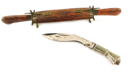 A Middle Eastern wooden carved twin handled knife set, and a Kukri, with turned handle and painted decoration, 46cm and 25cm long. (2)