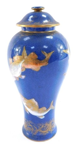 A Wedgwood lustre ware jar and cover, of baluster form, decorated with fish against a powder blue ground, pattern no Z4950, printed and painted marks, 22cm high.