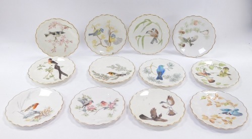 A set of twelve Royal Worcester cabinet plates, The Birds of Dorothy Dougherty dessert plates, each 24cm diameter.