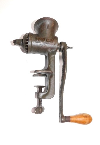 An American late 19thC Universal cast iron meat mincer, LF & C, New Britain, Conn., USA., 24cm high.