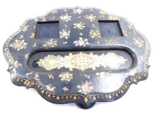 A Victorian papier mache desk stand, the flared top with applied gilt and mother of pearl detail, 29cm high.