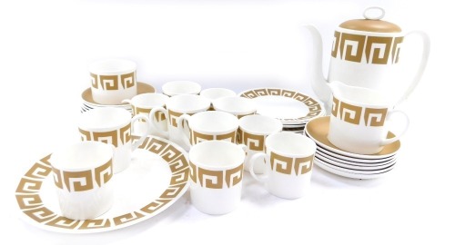 A Wedgwood Old Gold Keystone Susie Cooper design coffee service, comprising coffee pot, milk jug, sugar bowl, regular and demi-tasse coffee cans and saucers, cake plate, side plate, etc. (a quantity)