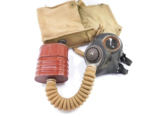 A War Ministry Issue gas mask, model No 4 III, in canvas carry case.