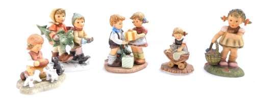 A group of Hummel figures, comprising Bowlful of Love, Tree Trimming Time, A Present for You, Spring Blossoms, and Snuggle Up, four boxed. (5)