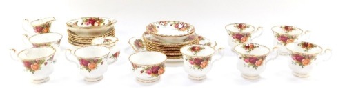 A Royal Albert Old Country Roses porcelain part tea service, comprising eight cups, two saucers, eight side plates, cake plate, milk jug, sugar bowl, trinket dishes, jar and cover. (1 tray)