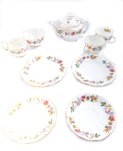 A Royal Crown Derby porcelain tete-a-tete, with floral decoration, gilt rims, comprising two trio sets, teapot, milk jug and sugar bowl.