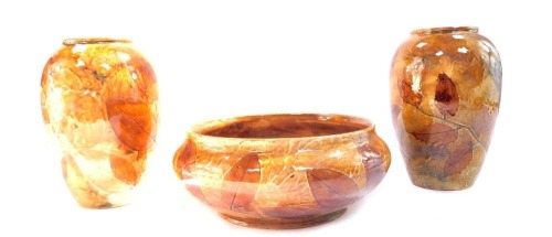 A set of Royal Doulton stoneware Natural Foliage wares, comprising a pair of autumnal vases, No X8531 2987, 17cm high, and a bowl, 18cm diameter. (3)