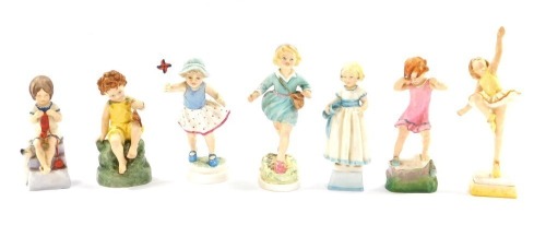 A set of Royal Worcester Seven Days female child figures, No 3522, 3259, 3262, 3523, 3258, 3257, and 3518, the largest 19cm high. (AF)