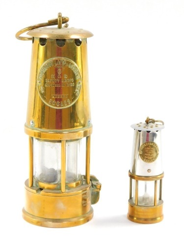 Two miners lamps, comprising a brass Eccles miners lamp, No 6, 23cm high, and a smaller example, 12cm high. (2)
