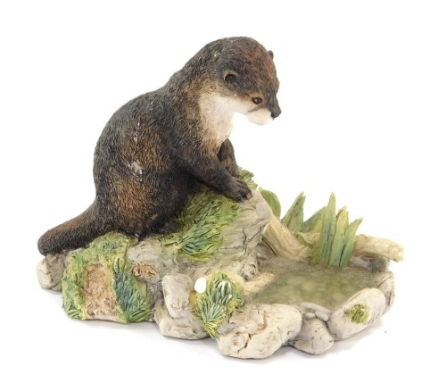 A Border Fine Arts Reflection figure, of a seated otter, MTR02, 8cm high. (AF)