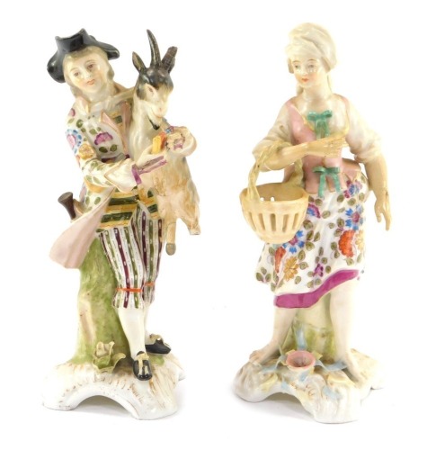 A pair of late 19thC Continental porcelain figures, comprising a lady with a basket and gentleman with a goat, gold anchor mark, 17cm high. (2)