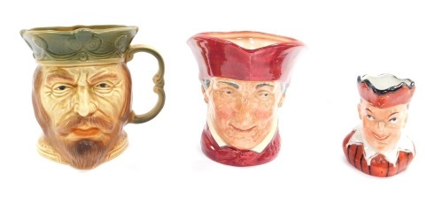 Three character jugs, comprising a Kingston Pottery character jug, Royal Doulton Cardinal character jug, 16cm high, and a late 19thC Mr Punch jug, 11cm high. (3)
