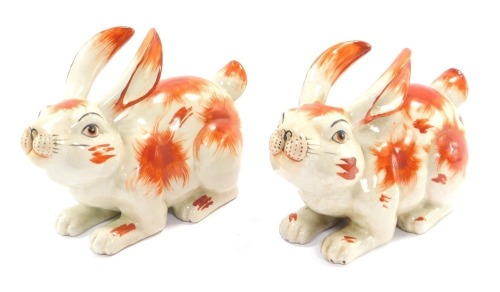 A pair of Chinese crackle glaze style rabbits, each seated, 18cm high.