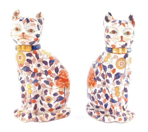 A pair of Imari style cat ornaments, modelled seated, each with bow tie, unmarked, 38cm high.