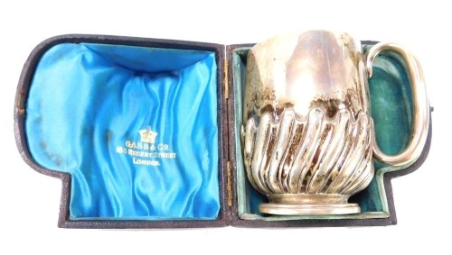 A Victorian silver christening cup, with semi fluted decoration, in presentation case for Gass & Co, 166 Regent Street, London, Holland Son & Slater, London 1883, 3&frac12;oz, 8cm high.