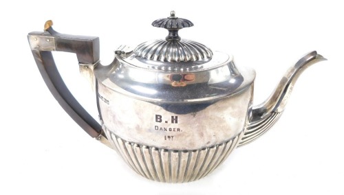 A Victorian semi fluted silver teapot, engraved 'B.H Danger 1st', Joseph Rodgers & Sons, Sheffield 1900, 18&frac12;oz.