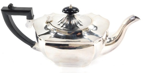 An EPNS silver plated teapot, on fluted body, with ebonised handle and knop.