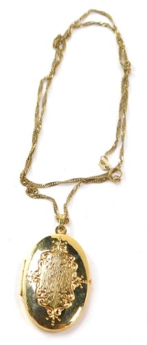 A 9ct gold locket and chain, the oval locket with central floral design panel, 3cm high, on a fancy link 9ct neck chain, 48cm long, 6.8g.