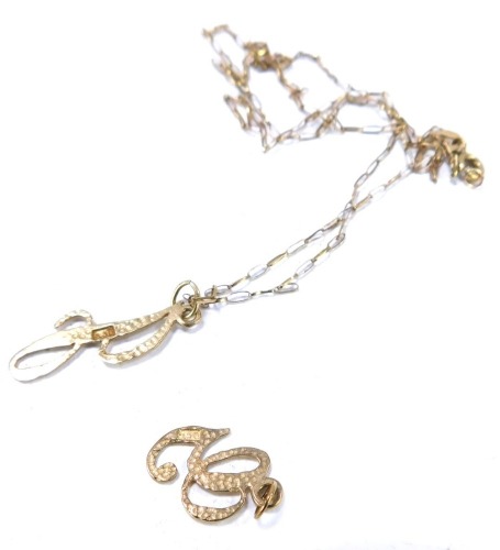 A 9ct gold J pendant and chain, together with additional G pendant, on an elongated box link chain, 2.1g, 46cm long.