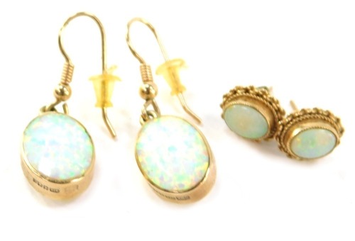 A pair of 9ct gold opal drop earrings, each 3cm high, together with a pair of single stud opal earrings, in 9ct gold frame, 6g all in. (4)