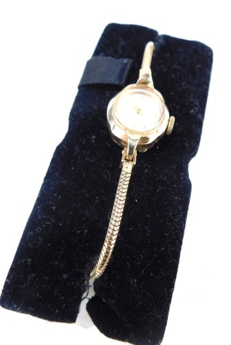 A Marvin 9ct gold cased lady's wristwatch, the watch head with silvered numeric dial, 1.5cm diameter, on a rope design bracelet, 17cm long overall, 11.5g all in, boxed.