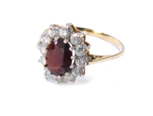 A 9ct gold floral cluster ring, set with blue and white paste stones in a raised basket setting, size M, 5g all in, boxed.