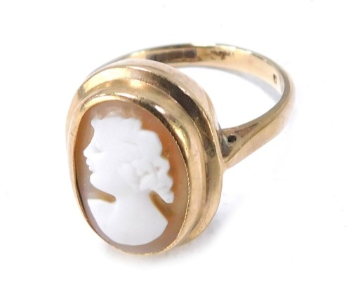 A 9ct gold cameo dress ring, the oval cameo with figure of maiden, with a rub over setting, loose, size O, 3.9g all in, boxed.