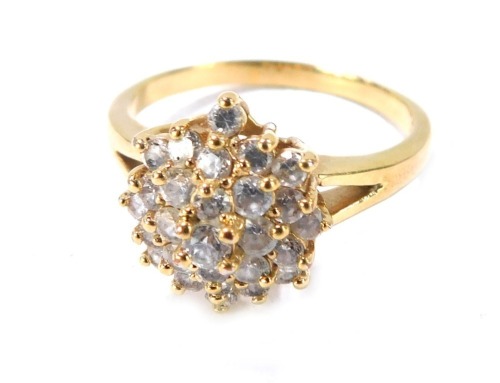 A plated dress ring, the central star design set with paste stones on V splayed shoulders, on a plated band, size X&frac12;.