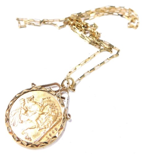 An Edward VII full gold sovereign pendant and chain, dated 1903, in a 9ct gold frame, with 9ct gold box link chain, 56cm long, 11.8g all in.