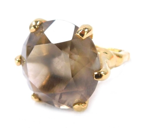 A smoky quartz dress ring, on a 22ct gold plated band and frame, boxed.