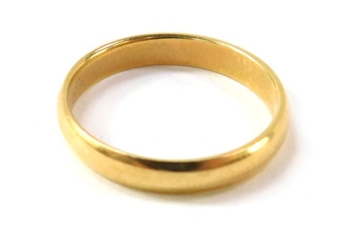 A wedding band, of plain design, stamped ARGYCR, size K.