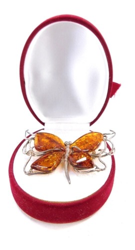 A butterfly brooch, silver plated with imitation amber beads, 6cm wide.