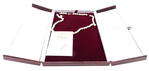 A cultured pearl pendant and earring set, the single strand necklace with 9ct gold clasp, 32cm long, together with a pair of associated studs with 9ct gold backs.